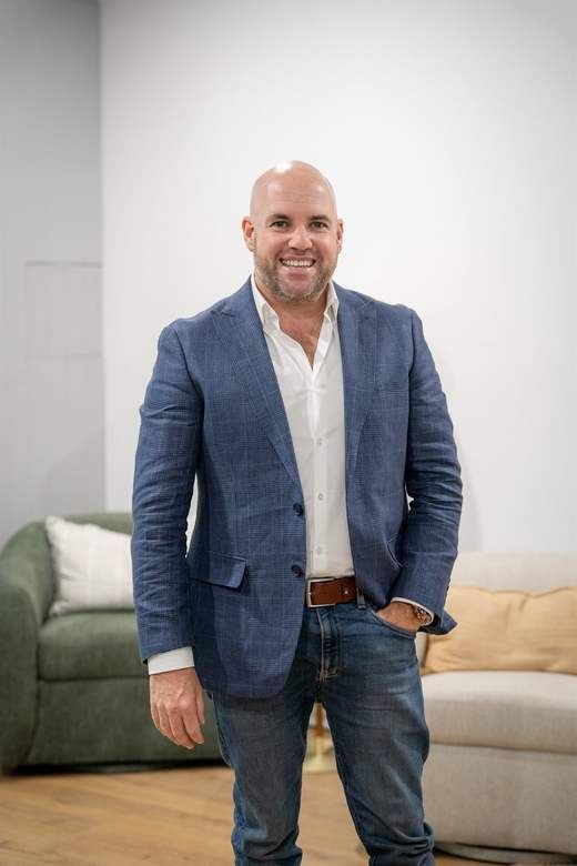 Steve Lowe of Agent Team in a styled Canberra living room